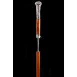 A 19TH CENTURY DAGGER STICK, with chased silver handle, malacca shaft with white metal collar