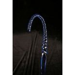 A MURANO BLUE GLASS CANE, with twisted handle and square section shaft, 103cm, together with another