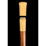 A 19TH CENTURY IVORY HANDLED CANE, the turned grip unscrewing to reveal empty compartment, with