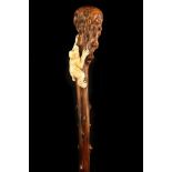 A 19TH CENTURY ONE PIECE ROOT WOOD WALKING CANE, the grip formed from the rounded root bole and