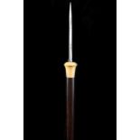 A GOOD 19TH CENTURY FLICK DAGGER CANE, with concealed steel blade covered with hinged cap, ivory