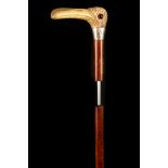 A 19TH CENTURY STAG HORN HANDLED SWORD STICK, the grip worked as a long billed duck with glass eyes,