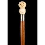 A 19TH CENTURY JAPANESE BONE HANDLED MALACCA CANE, the grip worked as a traditional helmet, inset