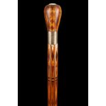 A PARQUETRY INLAID CANE, inlaid overall with exotic woods and mother of pearl brass ferrule, 87cm.