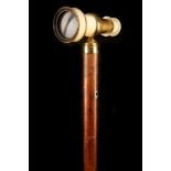 AN IVORY CLAD TELESCOPE CANE, the extending body on malacca shaft, with long brass ferrule, 90cm.