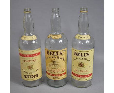 A Collection of Three Vintage 1 Gallon Bells Whisky Bottles 