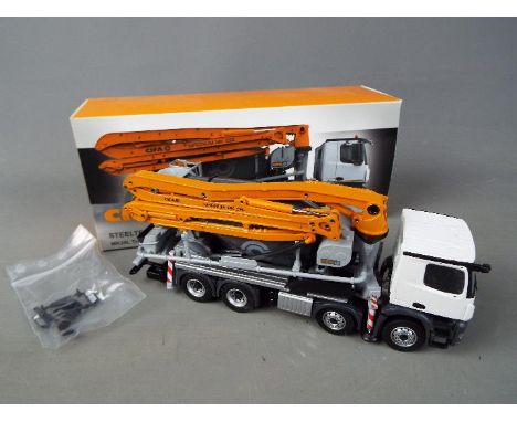 Conrad - A boxed Conrad #78232 diecast 1:50 scale 'CIFA' Steeltech Series MK28L Truck Mixer Pump. The model appears to be in 