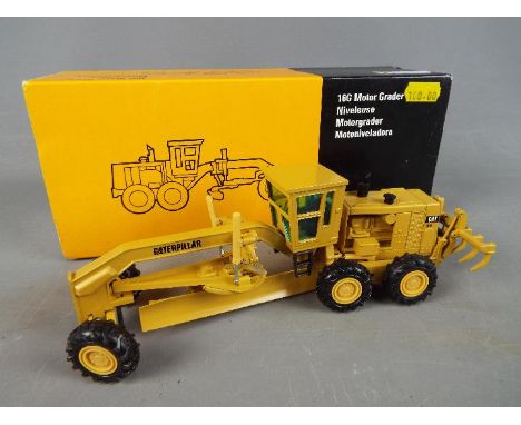 NZG - A boxed diecast 1:50 scale NZG #387 Caterpillar 16G Motor Grader. The model appears to be in Near Mint condition with j