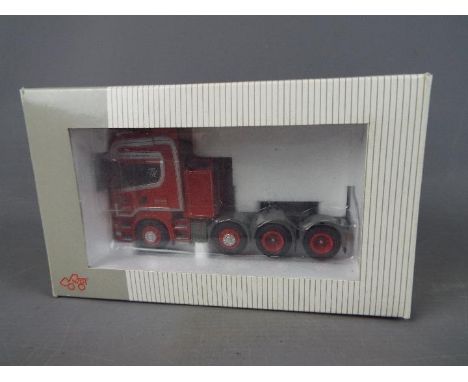 NZG - A boxed 1:50 scale diecast NZG #717/02 Scania 4 Axle Tractor Unit. Model appears to be in Mint condition, presented wit