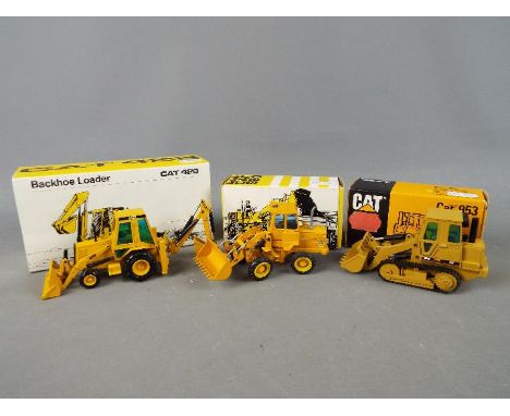 NZG, Gescha - A collection of three boxed diecast 1:50 scale scale construction vehicles. The lot consists of Gescha Caterpil