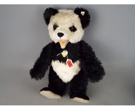 Steiff - an original Steiff Panda Bear, 1951 replica with growler, black and white 48 cm (high), button in ear with white tag