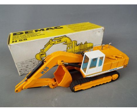 NZG - A boxed diecast 1:50 scale NZG #273 Demag Hydraulic Excavator. The model in yellow appears to be in Mint condition and 