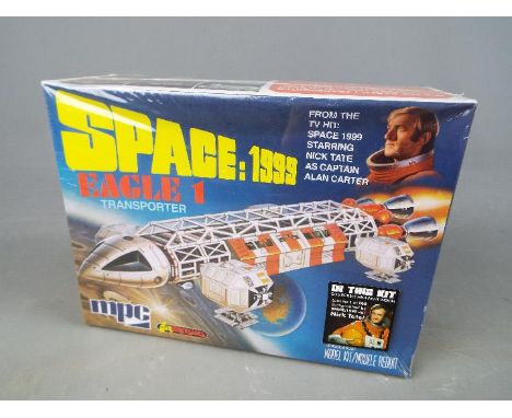 Space 1999 - a Space 1999 Eagle 1 Transporter model kit from the hit TV series Space 1999, includes a collectable mini print,