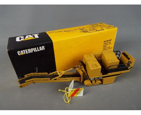 NZG - A boxed NZG 1:50 scale #299 Caterpillar PR-450 Pavement Profiler. The model appears to be in Excellent condition and ha