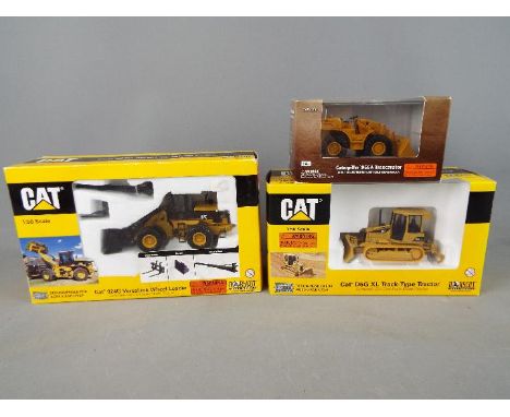 Norscot - Three boxed 1:50 scale diecast Norscot construction vehicles. Lot includes #55232 Caterpillar 966A Traxcavator; #55