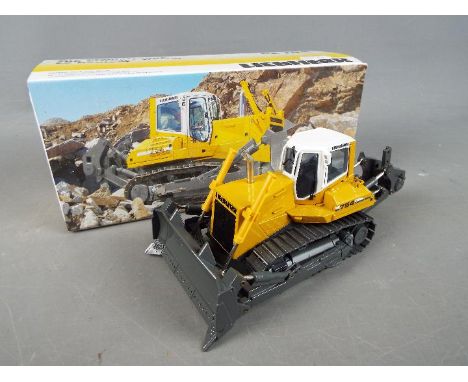 Conrad - A boxed diecast 1:50 scale Conrad #2808 Liebherr PR754 Litronic Crawler Tractor. The model appears to be in Mint con