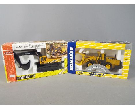 Joal - Two boxed 1:50 scale diecast construction vehicles by Joal. Lot consists of #204 Komatsu WA600-3 Log Loader; and #180 