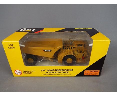 Norscot - A boxed 1:50 scale diecast Norscot #55191 Caterpillar AD45B Underground Articulated Truck. The model appears to be 
