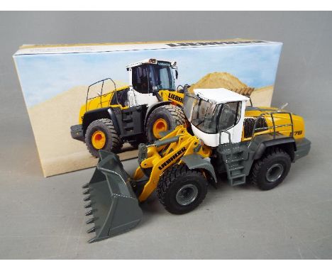 Conrad - A boxed 1:50 scale diecast Conrad #2443 Liebherr L576 Radlader Wheel Loader. Model appears to be in Mint condition p