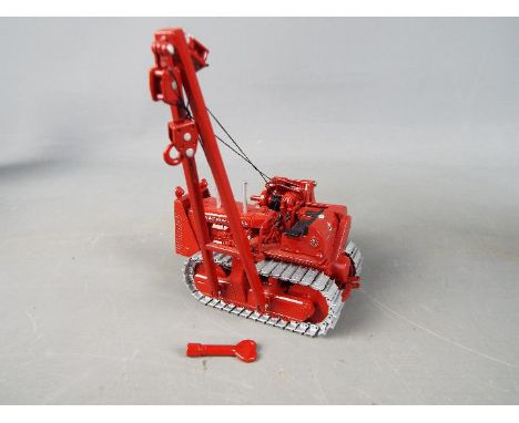 Spec Cast - A boxed 1:50 scale diecast Spec Cast International Harvester TD 24 Diesel Crawler with Superior Pipelayer. The mo