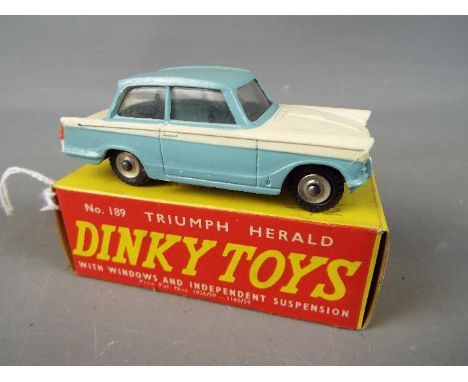 Dinky Toys - A boxed Dinky Toys #189 Triumph Herald The model in two tone white and light blue, has silver trim, and chrome s