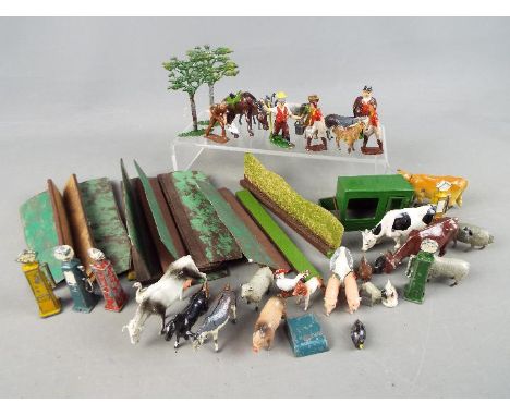 Britains and Similar - A collection of over 30 unboxed metal farm yard figures and accessories by Britains. Lot contains shee