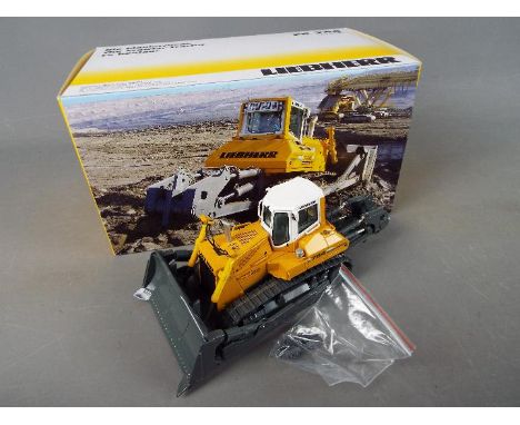 NZG - A boxed diecast 1:50 scale NZG #775 Liebherr PR764 Litronic Crawler Tractor. The model appears to be in Mint condition 