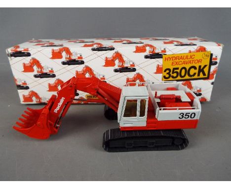 Conrad - A boxed diecast 1:50 scale Conrad #2924 'Heritage Collection no.3' Poclain 350CK Hydraulic Excavator. The model appe