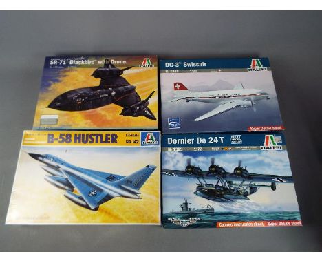 Italeri - a collection of four plastic model kits to include a DC-3 Swissair model No. 1349, 1:72 scale, a SR-71 Blackbird wi