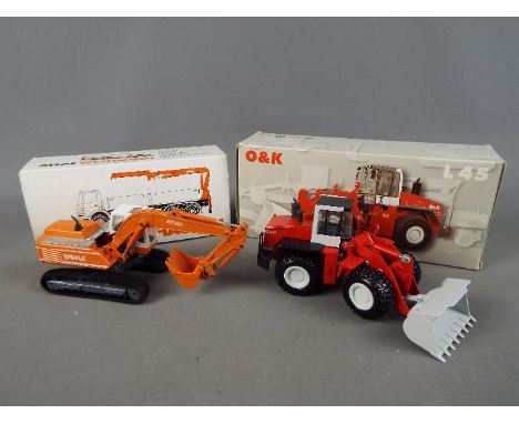 Conrad - Two boxed diecast 1:50 scale construction vehicles by Conrad. Lot consists of #2429 O&amp;K L45 Wheel Loader; and #2