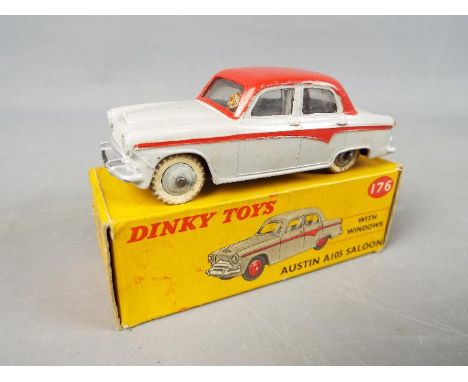 Dinky Toys - A boxed Dinky Toys #176 Austin A105 Saloon with Windows. The model in two-tone grey has ridged grey hubs with wh