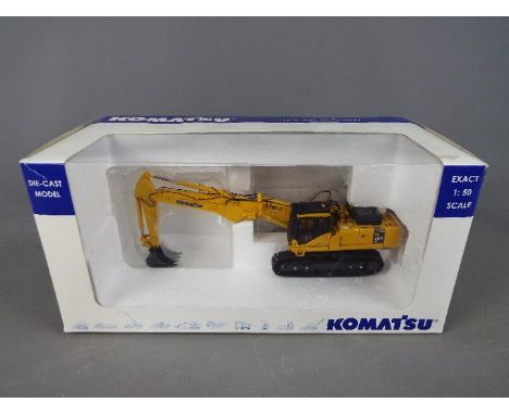 Universal Hobbies - A boxed diecast 1:50 scale Komatsu PC450 Excavator with Short Trowel. The model appears to be in Mint con