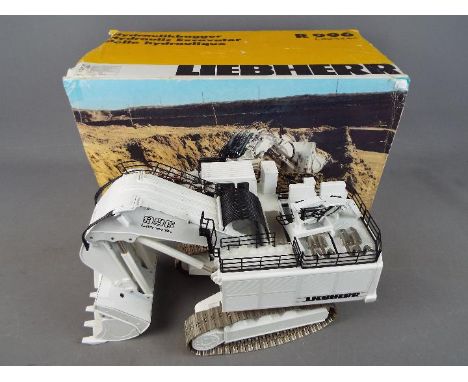 Conrad - A boxed diecast 1:50 scale Conrad #2811 Liebherr R 996 Litronic Hydraulic Excavator. This large model in white appea