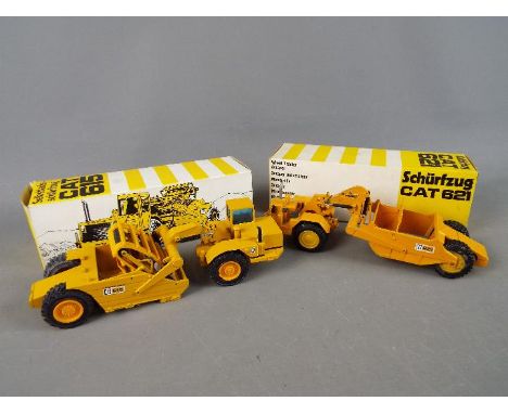 NZG -Two boxed diecast 1:50 scale scale construction vehicles by NZG. The lot consists of NZG #122 Caterpillar 621 Wheel Trac