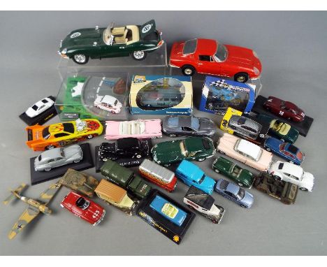 Ertl, Corgi, Bburago, Solido, Others - A collection of mainly unboxed diecast, plastic model vehicles. Lot includes an unboxe