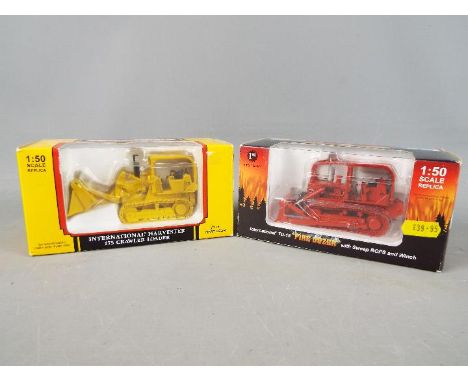 First Gear - Two boxed International diecast model construction vehicles from First Gear. Lot consists of #50-3058 Internatio