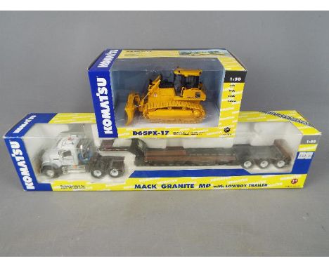 First Gear - Two boxed diecast 1:50 scale vehicles from First Gear. Lot consists of #59-3106 Mack Granite MP with Lowboy Trai