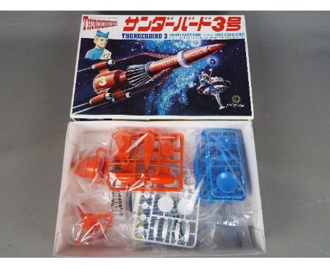 Aoshima - A boxed 1:350 scale Aoshima 'Thunderbirds 3' plastic model kit. The moulded colour contents are in sealed clear pla