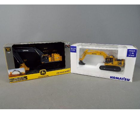 Ertl, Universal Hobbies - Two boxed diecast 1:50 scale construction vehicles, including Ertl #15862 John Derre 450D LC Excava