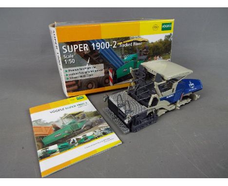 NZG - A boxed diecast 1:50 scale NZG #671 Vogele Super 1900-2 Tracked Paver. The model appears to be in Mint condition housed