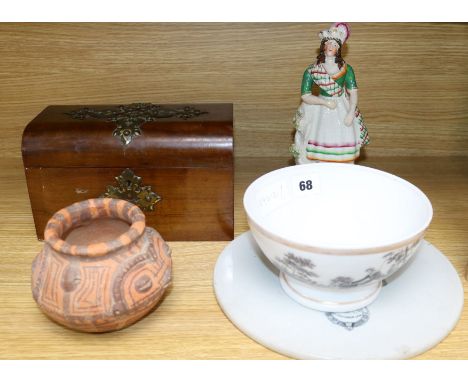 A Staffordshire figure, a circular plaque, a terracotta pot, a ceramic bowl and a tea caddy