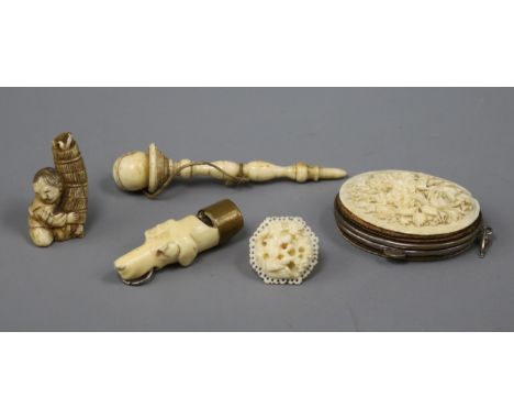 A Victorian ivory whistle modelled as the head of a hound and four other items, including a carved ivory bilboquet, a small i