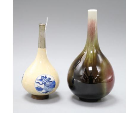 A Chinese blue and white bottle vase and a flambe bottle vase, Kangxi or later tallest 19.5cm