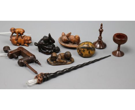 Three carved wood netsukes and sundry other treen, the netsukes including an embracing couple, a monkey standing on a pig and