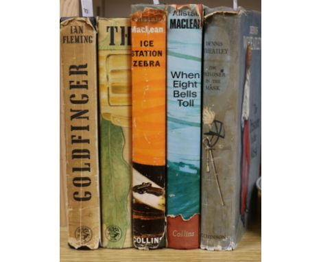 A small collection of books, including Ian Fleming, Goldfinger (1959, first edition) and The Man With the Golden Gun (1965, s