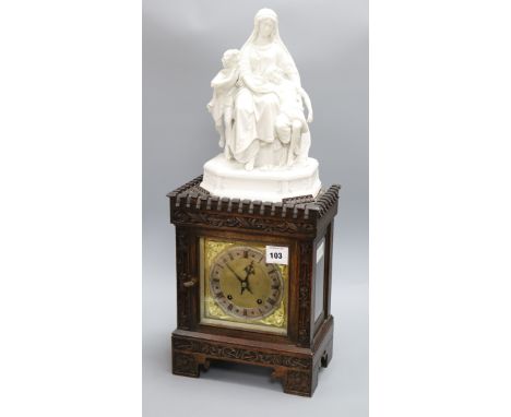 An Edwardian parian-topped oak mantel clock, figural mounts overall height 66cm