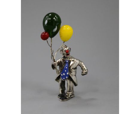 A white metal, enamel and glass set figure of a clown with balloons, 86mm.