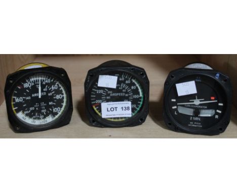 Three vintage light aircraft instruments (two being airspeed and a turn coordinator)