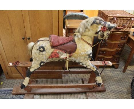 A mid-century carved wood 'Collinson' Rocking Horse, dapple grey painted on a gesso ground, remains of real horse hair mane a