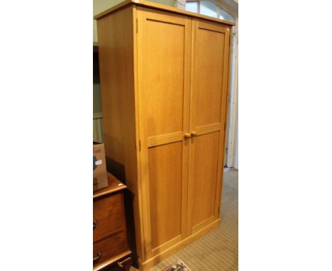 A modern light oak two door wardrobe with hanging rail and internal shelf&nbsp;90cm wide x 55cm deep x 163cm high